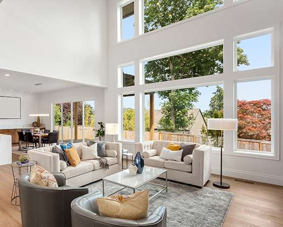 Climate Solutions 8100 Series Picture Window showcased in a beautiful living room.