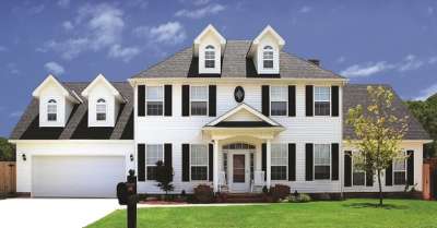 Gentek Aurora II Vinyl Siding showcasing a beautiful home outdoors.