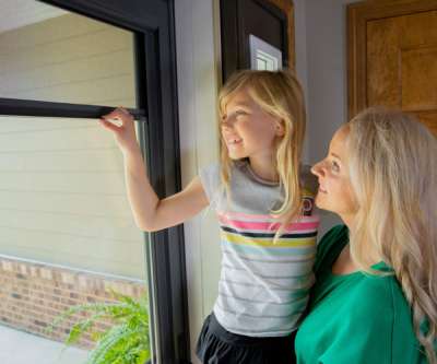 Larson Door Style Screen Away with a mom and daughter looking outside.
